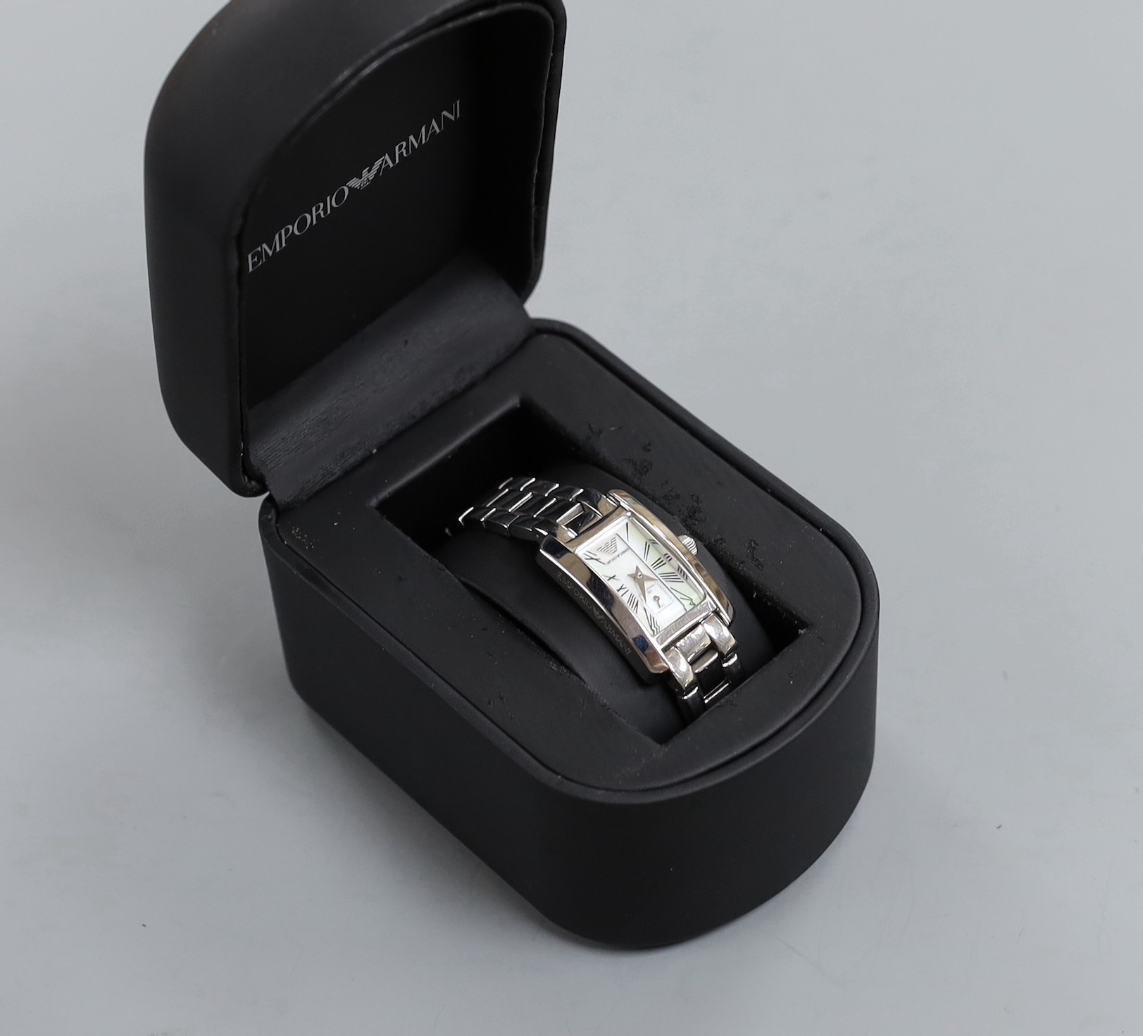 A lady's modern Emporio Armani quartz wrist watch, with mother of pearl dial and box.